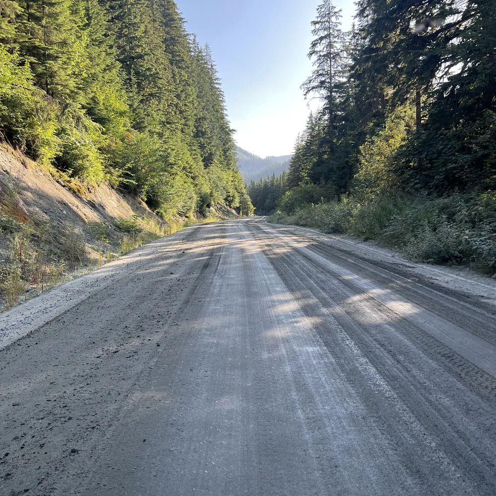 Dust Suppression in Fraser Valley underway as a water truck treats a busy gravel access road